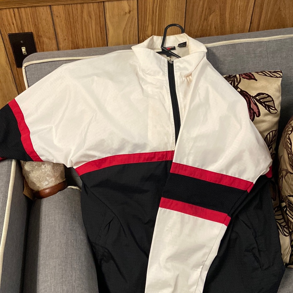 White black and red wind breaker